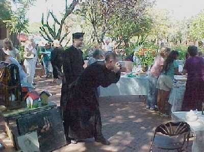 Father Smith takes a picture